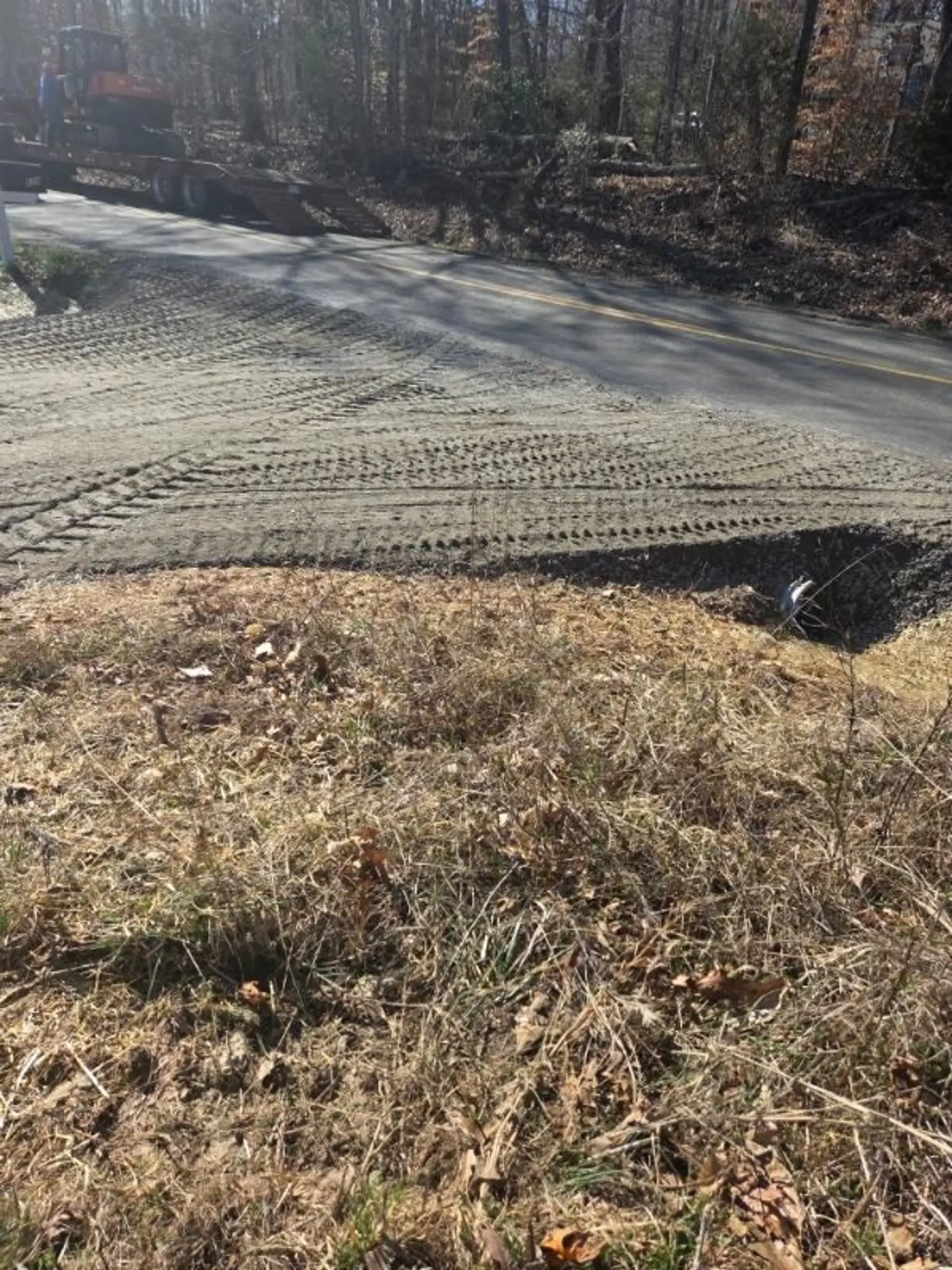 Graded slope stabilized with erosion-control matting