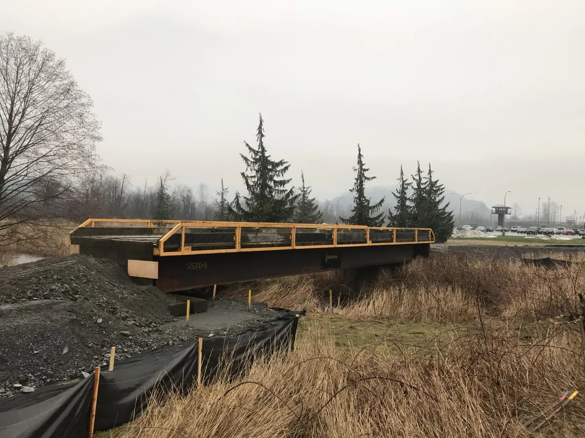 New culvert crossing built across a field with silt fencing